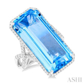 26x12 MM Emerald Cut Blue Topaz and 1/2 ctw Round Cut Diamond Halo Semi Precious Ring in 14K White Gold