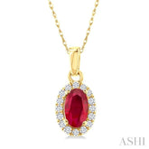 5x3 MM Oval Shape Ruby and 1/20 Ctw Round Cut Diamond Halo Precious Pendant with Chain in 14K Yellow Gold