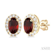 5x3 MM Oval Shape Garnet and 1/8 Ctw Round Cut Diamond Halo Semi-Precious Stud Earrings in 10K Yellow Gold