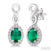 5x3 MM Oval Cut Emerald and 1/6 ctw Round Cut Diamond Earrings in 10K White Gold
