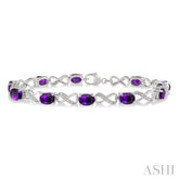 7x5 MM Oval Cut Amethyst and 1/10 ctw Round Cut Diamond Semi Precious Infinity Bracelet in Sterling Silver