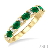 4x3 MM Oval Shape Emerald and 1/6 ctw Round Cut Diamond Precious Band in 14K Yellow Gold