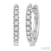 1/8 ctw Round Cut Diamond Huggie Petite Earrings in 14K White Gold