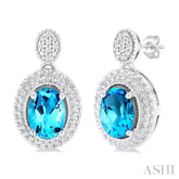 7X5 MM Oval Cut Blue Topaz and 1/20 ctw Round Cut Diamond Semi Precious Earring in Sterling Silver