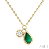 5x3 MM Pear Cut Emerald and 1/50 ctw Bezel Set Round Cut Diamond Precious Pendant With Chain in 10K Yellow Gold
