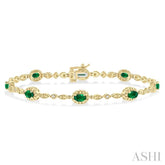 5x3 MM Oval Cut Emerald and 1/20 ctw Single Cut Diamond Bracelet in 10K Yellow Gold