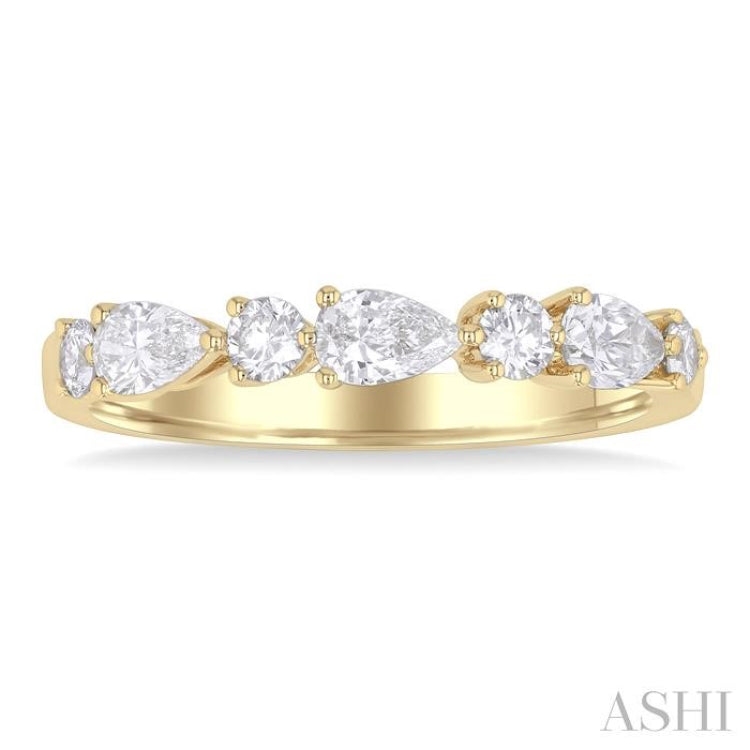 5/8 ctw Pear and Round Cut Diamond Fashion Band in 14K Yellow Gold