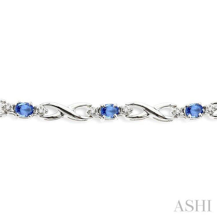 4x3mm Oval Cut Tanzanite and 1/10 Ctw Single Cut Diamond Bracelet in 10K White Gold