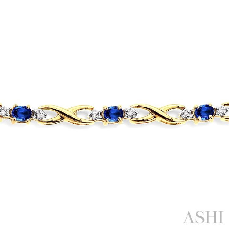4x3 MM Oval Cut Sapphire and 1/10 Ctw Single Cut Diamond Bracelet in 10K Yellow Gold