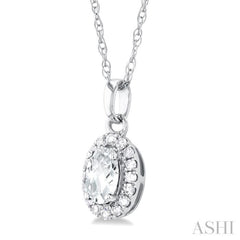 5x3 MM Oval Shape White Topaz and 1/20 Ctw Single Cut Diamond Halo Semi-Precious Pendant with Chain in 14K White Gold