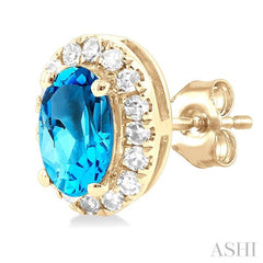 5x3 MM Oval Shape Blue Topaz and 1/8 Ctw Round Cut Diamond Halo Semi-Precious Stud Earrings in 10K Yellow Gold