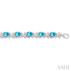 7x5 MM Oval Cut Blue Topaz and 1/10 ctw Round Cut Diamond Semi Precious Bracelet in Sterling Silver