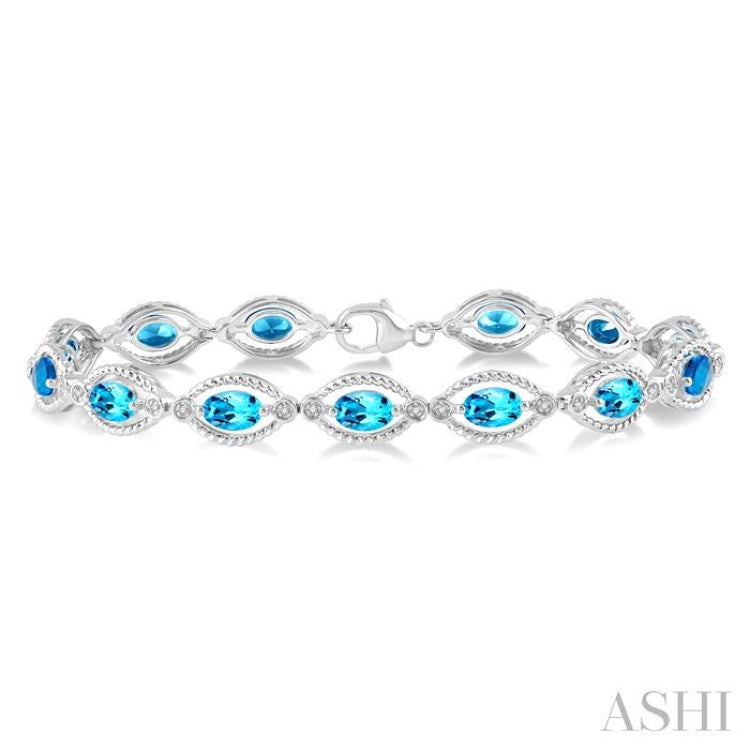 6x4 MM Oval Cut Blue Topaz and 1/10 ctw Round Cut Diamond Semi Precious Bracelet in Sterling Silver