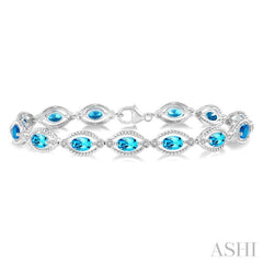 6x4 MM Oval Cut Blue Topaz and 1/10 ctw Round Cut Diamond Semi Precious Bracelet in Sterling Silver