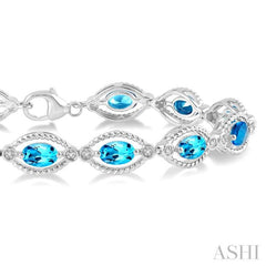 6x4 MM Oval Cut Blue Topaz and 1/10 ctw Round Cut Diamond Semi Precious Bracelet in Sterling Silver