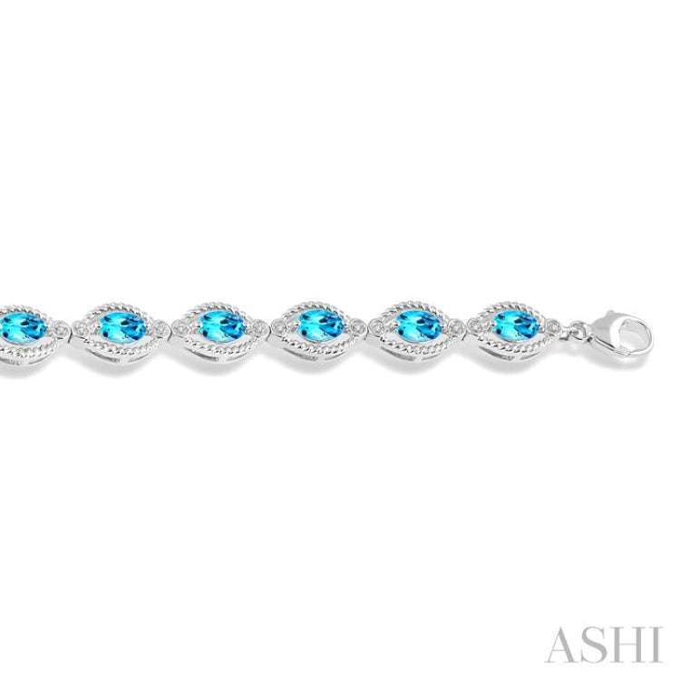 6x4 MM Oval Cut Blue Topaz and 1/10 ctw Round Cut Diamond Semi Precious Bracelet in Sterling Silver