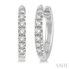 1/8 ctw Round Cut Diamond Huggie Petite Earrings in 14K White Gold