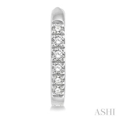 1/8 ctw Round Cut Diamond Huggie Petite Earrings in 14K White Gold