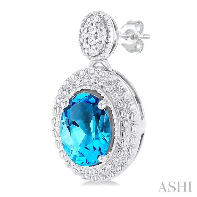 7X5 MM Oval Cut Blue Topaz and 1/20 ctw Round Cut Diamond Semi Precious Earring in Sterling Silver