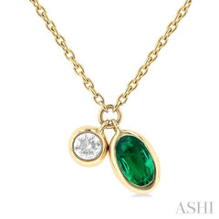 5x3 MM Oval Cut Emerald and 1/50 ctw Bezel Set Round Cut Diamond Precious Pendant With Chain in 10K Yellow Gold