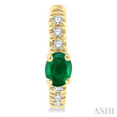 4X3 MM Oval Cut Emerald and 1/10 ctw Petite Round Cut Diamond Fashion Huggies in 10K Yellow Gold