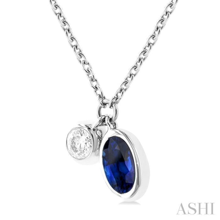 5x3 MM Oval Cut Sapphire and 1/50 ctw Bezel Set Round Cut Diamond Precious Pendant With Chain in 10K White Gold