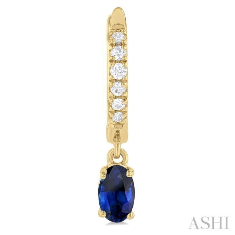 5x3 MM Oval Cut Sapphire and 1/8 ctw Petite Round Cut Diamond Precious Fashion Huggies in 10K Yellow Gold