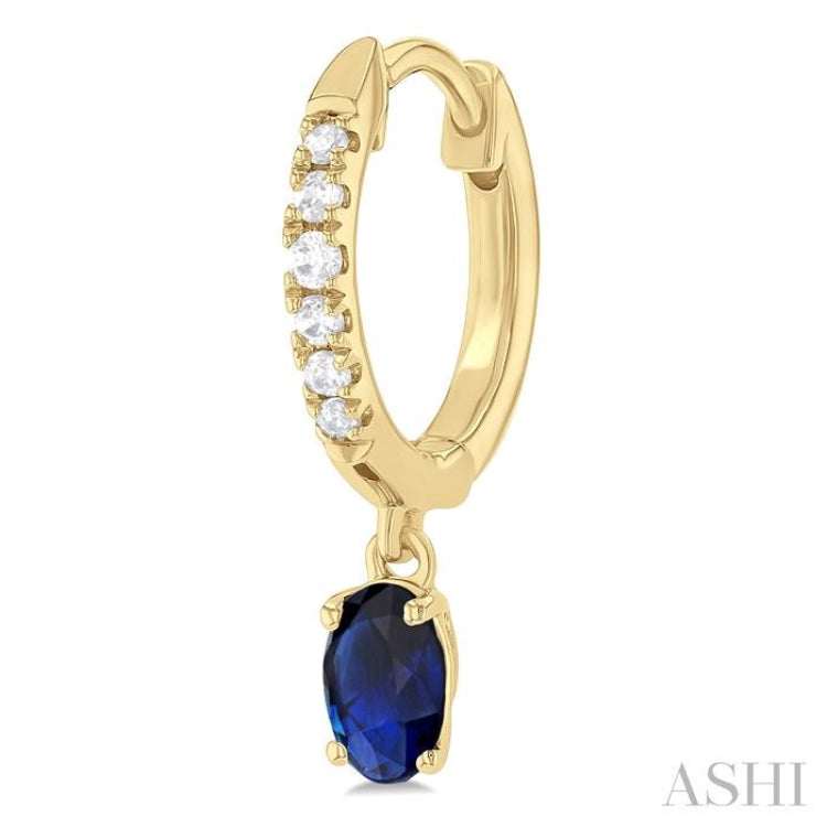 5x3 MM Oval Cut Sapphire and 1/8 ctw Petite Round Cut Diamond Precious Fashion Huggies in 10K Yellow Gold